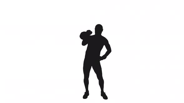 Silhouette Of Sportsman Doing Single Arm Kettlebell Press Pushup alt