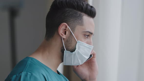 Latin Man Medical Assistant Doctor in Medical Mask Consulting Patient Remote Discussing Issues By