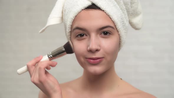 Girl Applying Powder with Brush