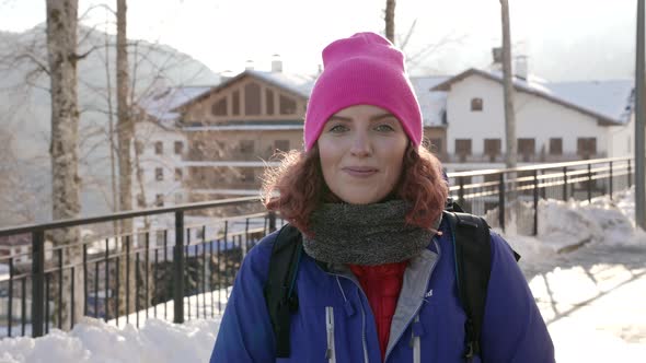 Happy Woman is Walking in Small Resort City at Winter Day Portrait Outdoors