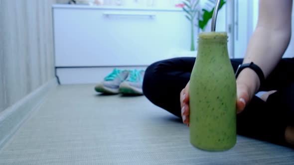 Woman Drinking Seasonal Matcha Green Vegan Smoothie with Chia Seeds and Mint Smoothie Drink Detox