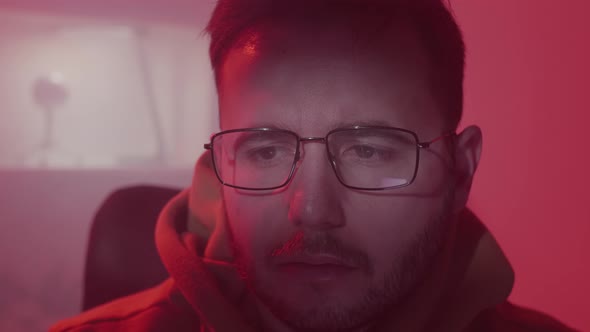 A Caucasian Man in Glasses Works on the Computer Inputs Code Types Very Fast on the Keyboard Checks