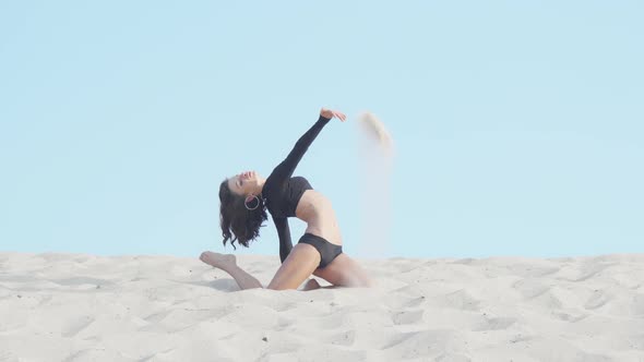 Flexible Female Dancer Performing Outdoors in the Desert