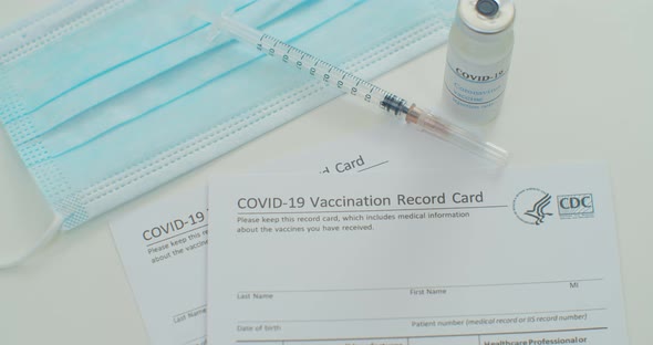 Medical Mask and COVID19 Vaccine on Vaccination Record Card Approved By CDC with Corona Virus