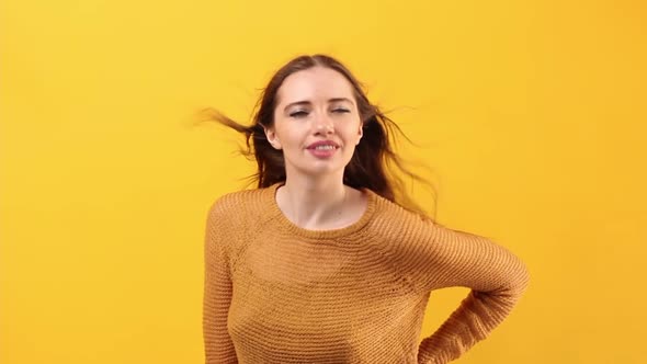 Young Beautiful Woman European Appearance Posing Studio Pastel Yellow Background