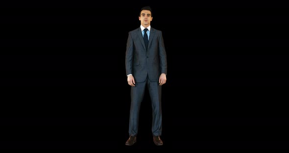 Businessman standing against black background