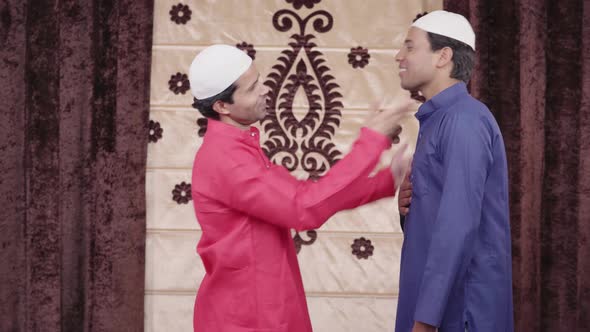 Muslim man congratulating his friend