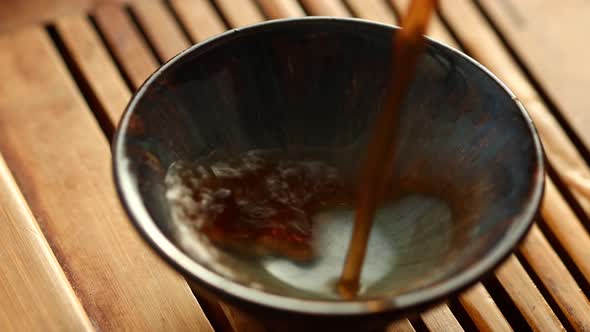 Chinese Tea is Poured Into a Bowl