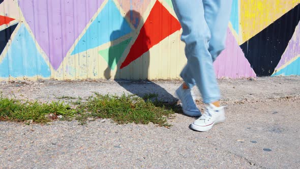 Legs of a Person Dancing in the Street