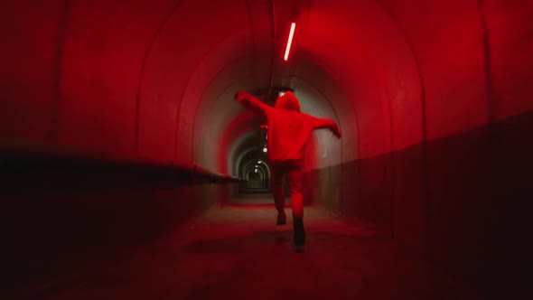 Parkour Athlete Running in Tunnel and Doing Front Flip