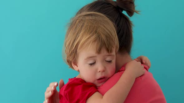 Mother Hugging Adorable Little Child