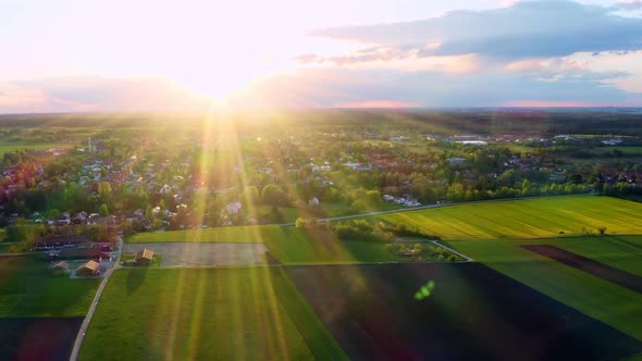 The sun is shining over an idyllic placed little town in southern bavaria - right sided panning dron