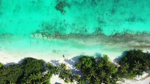 Beautiful aerial clean view of a white paradise beach and blue sea background in colourful 