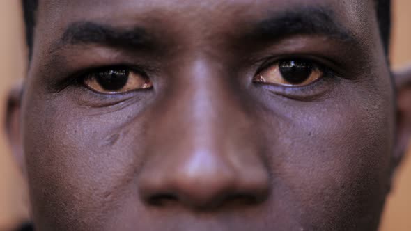 sad serious african american young man staring at camera- close up