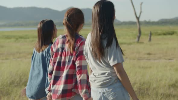Group of young Asian women running having fun together a summer traveling.