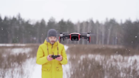 Drone flies in front of the camera, close-up