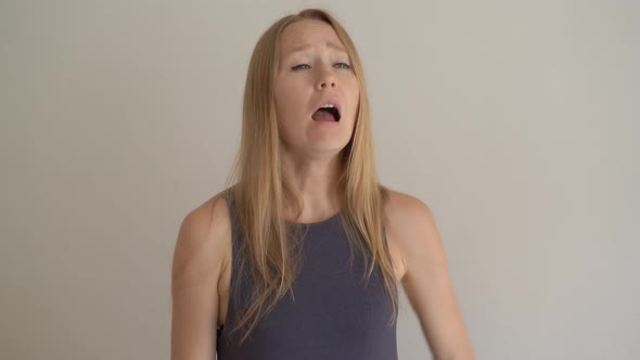 A Young Woman Sneezes Properly