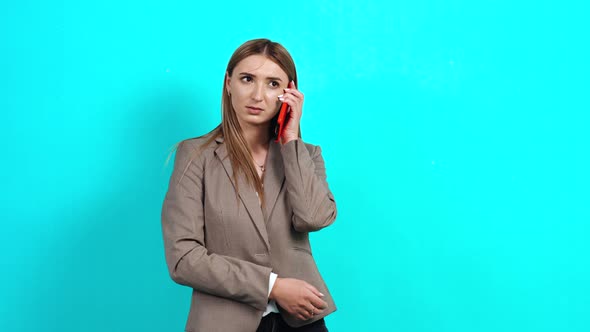 Cheerful and Friendly Young Woman with Brown Hair in Business Style Jacket