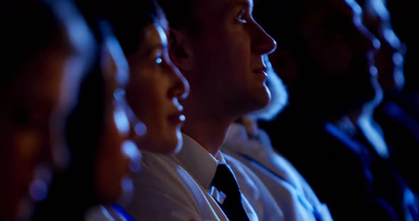 Young Caucasian businessman attending business seminar in auditorium 4k