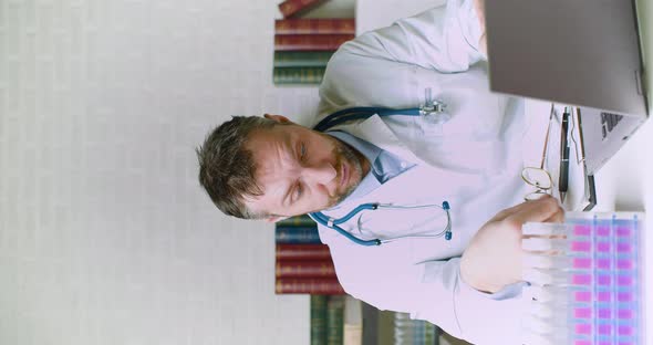 Vertical Video of a Doctor Working Long Hours