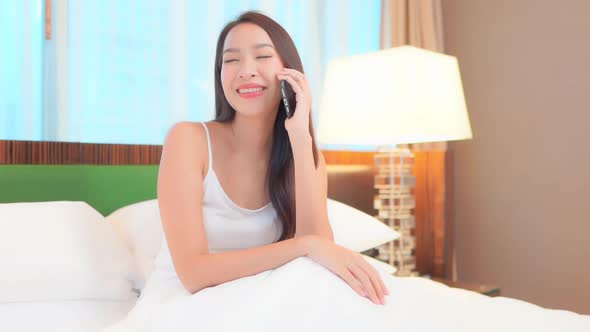 Young asian woman use smart phone