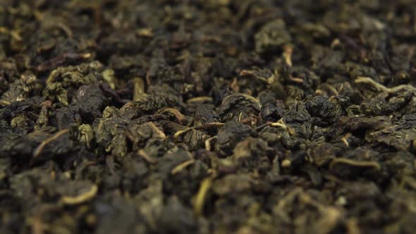 Dried green oolong tea leaves rotate