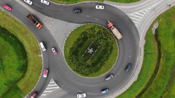 Cars Drive Around Large Turning Circle in Rural Area