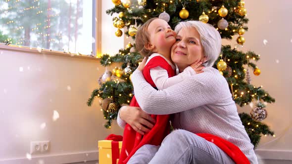 Grandmother and Baby Girl Hugging on Christmas