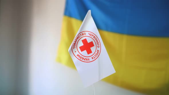 White Flag with Red Cross Emblem