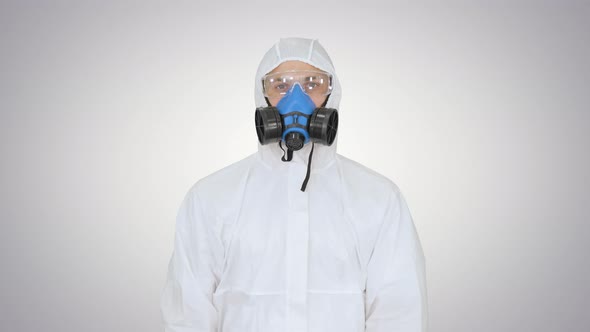 Epidemiologist Showing Stop Sign and Showing Cross with His Hands on Gradient Background alt