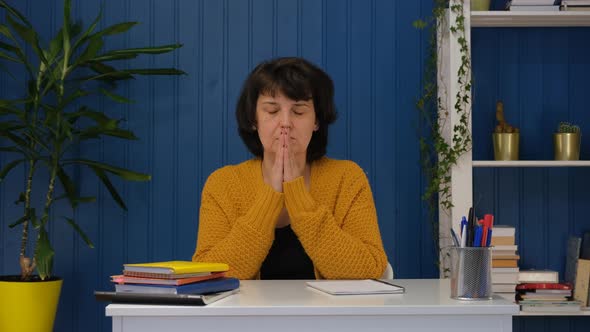 Religious Middle Aged Woman Sit with Eyes Closed Put Hands in Prayer Praying alt