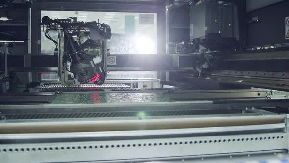 Surface Mount Technology SMT Machine places components on a circuit board