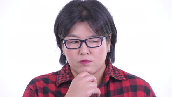Face of Stressed Overweight Asian Hipster Woman Thinking and Looking Down