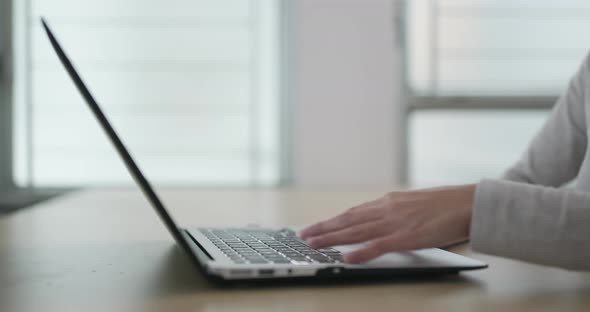 Woman working on laptop computer