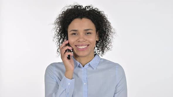 Portrait of Focused Young African Woman Talking on Smartphone