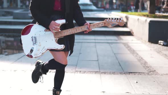 Young Asianl Girl with Electric Guitar