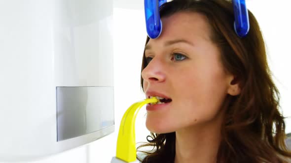 Female patient receiving dental treatment