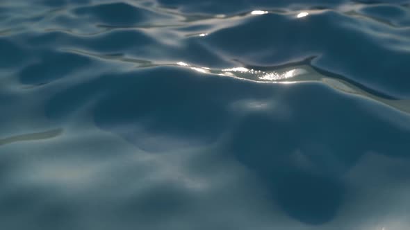 Bright Blue Sea Wave Surface in Motion