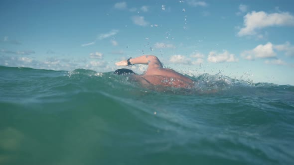 Professional Triathlete Swimming On Lake At Sunset. Swim Preparing To Triathlon Competition.