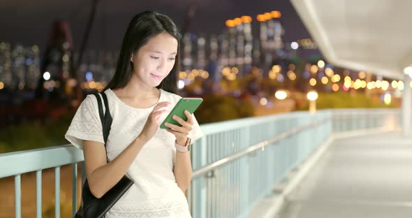 Woman use of mobile phone at night