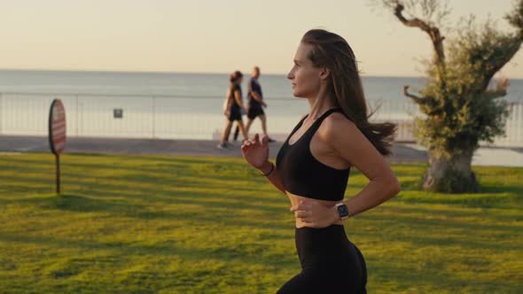Healthy Lifestyle Beautiful Asian Woman Running at Sunrise Seaside