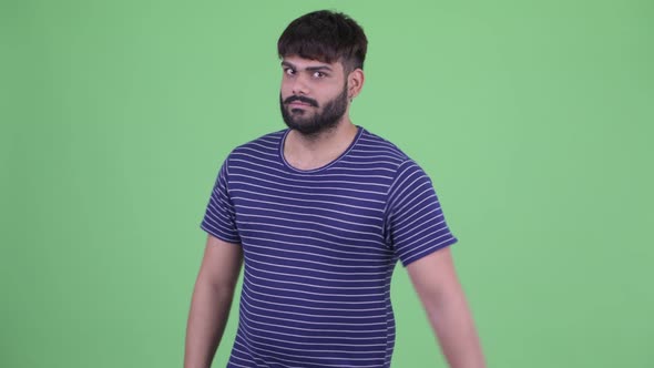 Happy Young Overweight Bearded Indian Man with Ok Sign