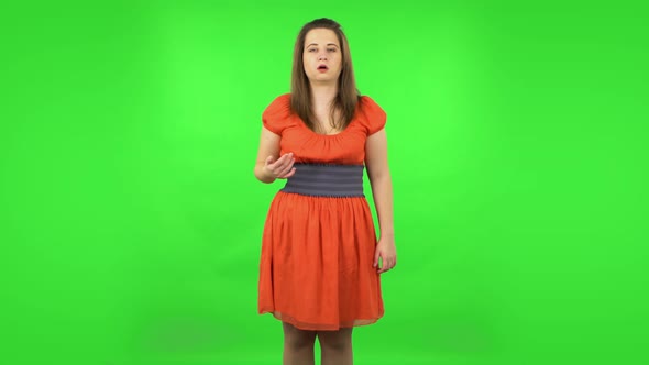 Cute Girl Cooling Herself By Her Hand, Suffering From High Temperature Weather. Green Screen
