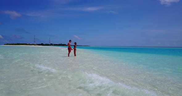 Beautiful man and woman after marriage in love have fun on beach on clean white sand 4K background