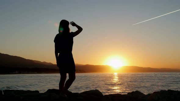 Female Waving Hand Welcomes Romantic Dawn