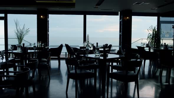 Spacious Panoramic Restaurant Interior in Evening Dusk