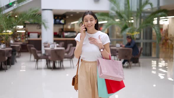 Female Shopaholic Bragging About Her Purchases in Mall During Seasonal Sales