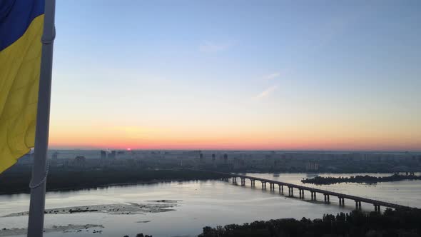 Ukrainian Flag in the Morning at Dawn. Aerial. Kyiv. Ukraine