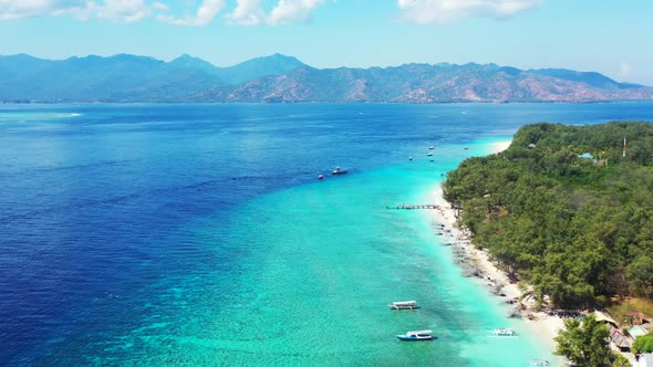 Aerial top down texture of tranquil resort beach trip by turquoise sea and white sandy background of