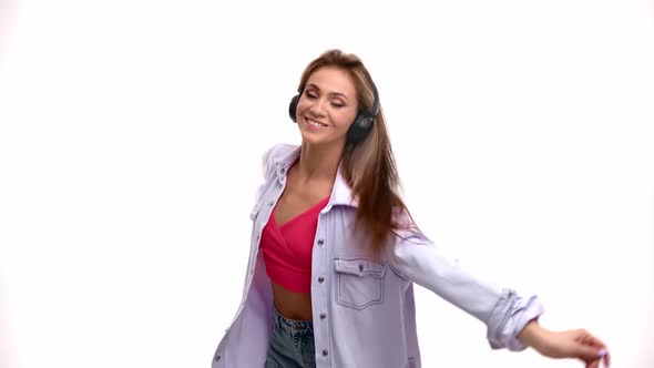 Joyful Smiling Casual Woman in Headphones Dancing Listening Music Isolated